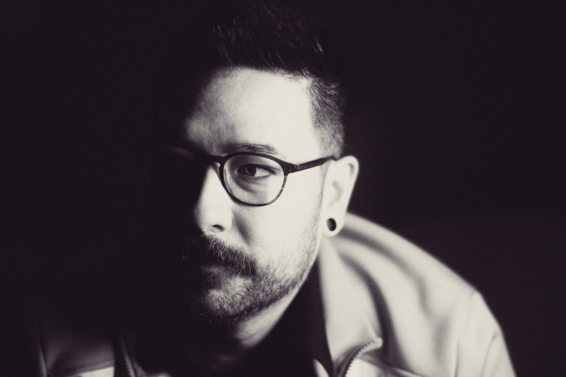 A image of a concrete sphere, balanced between two other larger spheres